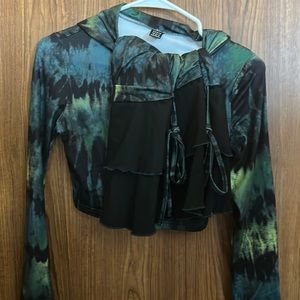 A 2pc set with a skirt and long sleeve cropped sweater